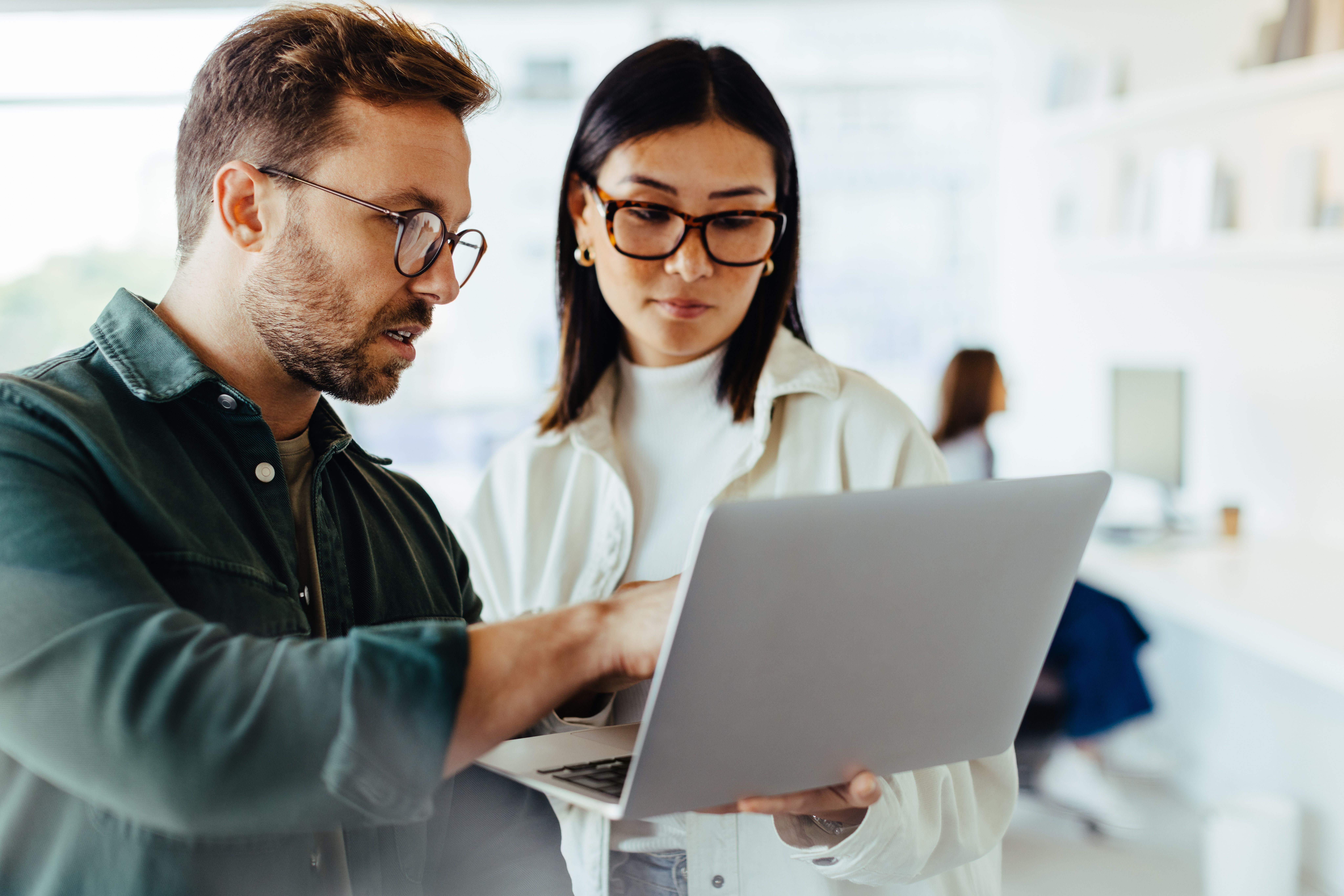 Two people looking at computer