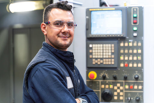 Engineer Standing By Panel