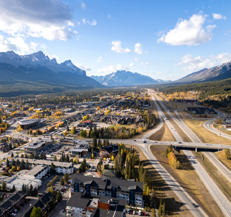 Aerial view of Trans-Canada Highway (Highway 1) exit 89 to Downtown Canmore in Canadian Rockies, Alberta, Canada. 