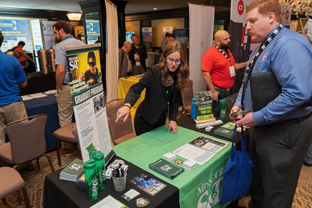 NSPECon Exhibitor Meeting with an attendee.