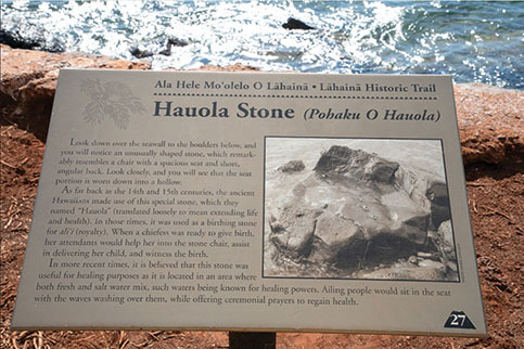 A sign provides visitors details about the historic Hauola Stone (healing stone or birthing stone) in Lahaina, Hawaii. (US Army Corps of Engineers photo by Mark Haviland)