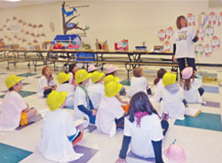 STUDENTS DONNED HARDHATS TO LEARN ABOUT BUILDING RESILIENT HOUSES.