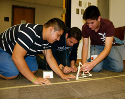 Students test their catapult at a Society of Hispanic Professional Engineers Noche de Ciencias (Science Night).