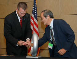 Scott Wolf, P.E., F.NSPE (left), helped administer the Order of the Engineer ceremony on July 2.