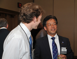 NSPE members John Pekar, P.E., of Alaska, and Takeya Kawamura, P.E., of Japan, network during a reception.