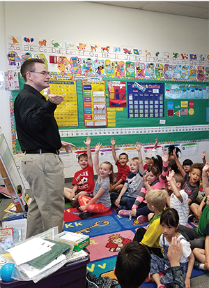 NSPE MEMBER CRAIG SISCO, P.E., F.NSPE, TALKS TO A GROUP OF KINDERGARTNERS IN NEVADA.