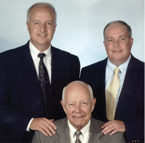 TREY HORNOR (LEFT), PAUL A. HORNOR, JR. (SEATED), AND JOHN HORNOR (RIGHT). 
