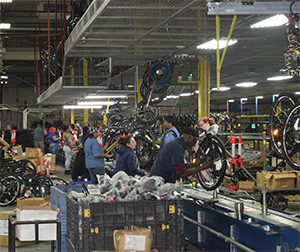 WHEEL BUILDING REQUIRES MANUAL WORK IN ADDITION TO AUTOMATED PROCESSES.