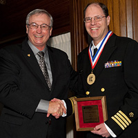 Captain Richard Gelting, Ph.D., P.E.(right), NSPE President Dan J. Wittliff, P.E., DEE, F.NSPE (left)