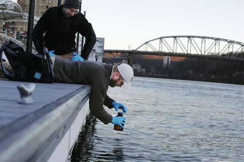 RESEARCHERS FROM WEST VIRGINIA WATER RESEARCH INSTITUTE COLLECT SOIL AND WATER SAMPLES FROM THE ELK RIVER IN CHARLESTON, WEST VIRGINIA.