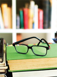 Eyeglasses on a stack of books